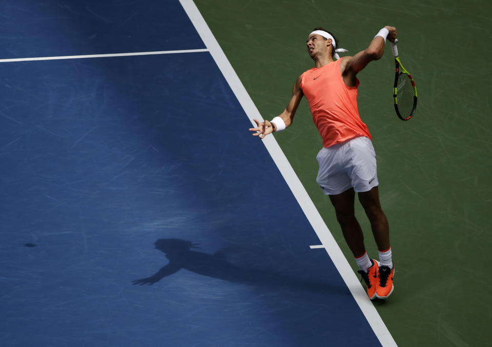 Rafael Nadal, of Spain, serves to Nikoloz Basilashvili, of Georgia, during the fourth round of the U.S. Open tennis tournament, Sunday, Sept. 2, 2018, in New York. (AP Photo/Carolyn Kaster)