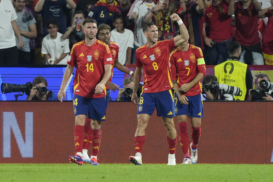 Spain's Fabian Ruiz (8) celebrates after scoring during a round of sixteen match between Spain and Georgia at the Euro 2024 soccer tournament in Cologne, Germany, Sunday, June 30, 2024. (AP Photo/Martin Meissner)