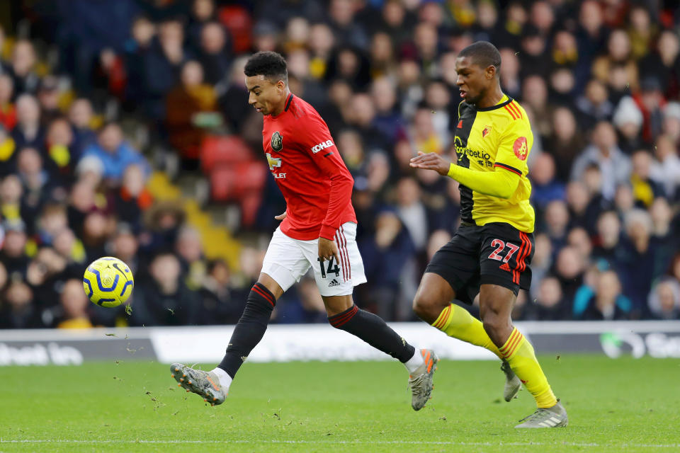 WATFORD, ENGLAND - DECEMBER 22: Jesse Lingard of Manchester United misses a chance as he is challenged by Christian Kabasele of Watford during the Premier League match between Watford FC and Manchester United at Vicarage Road on December 22, 2019 in Watford, United Kingdom. (Photo by Richard Heathcote/Getty Images)