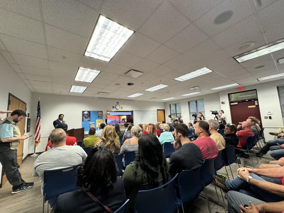 Leon County Commissioner Bill Proctor speaks to the crowd at the town hall he held with the Tallahassee Professional Firefighters.