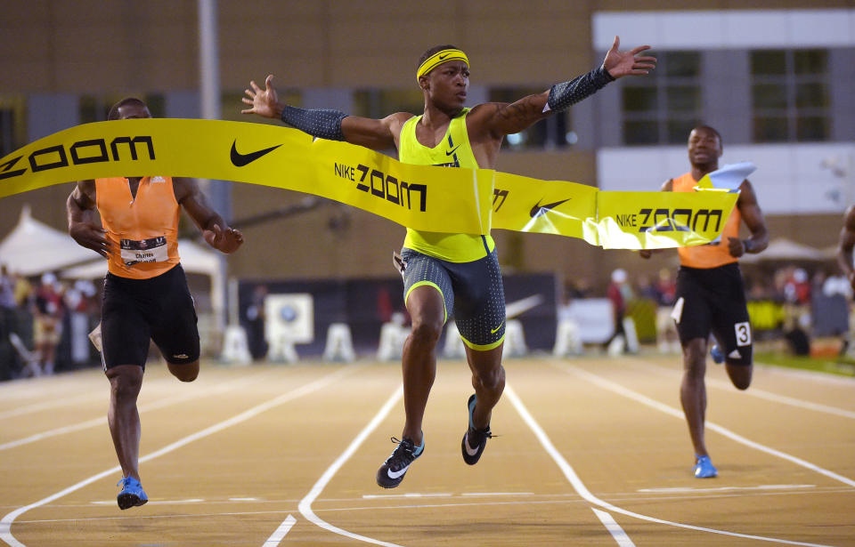 FILE - Mike Rodgers, center, wins the men's 100 meters ahead of Charles Silmon, left, and Mookie Salaam at the U.S. outdoor track and field championships in Sacramento, Calif., in this Friday, June 27, 2014, file photo. Seattle Seahawks wide receiver DK Metcalf has accepted an invitation to run the 100 meters at the USA Track and Field Golden Games in Walnut, California, to test his speed. "It's a pride thing for track athletes," Olympic sprinter Mike Rodgers said. "We've been hearing about this for so long. So giving him a proper introduction to track is going to be everything to everybody in the track world." (AP Photo/Mark J. Terrill, File)