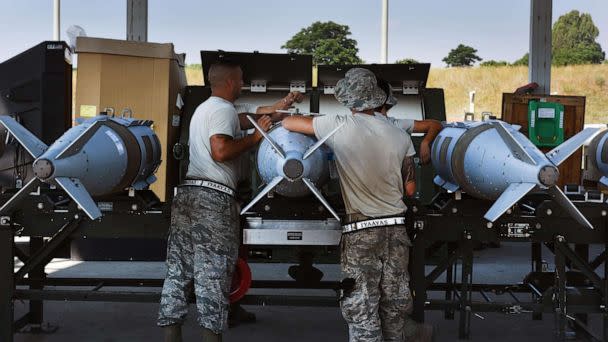 PHOTO: U.S. Airmen assigned to the 447th Expeditionary Aircraft Maintenance Squadron perform maintenance on joint direct attack munition GBU-31s, June 16, 2017, at Incirlik Air Base, Turkey. (Airman 1st Class Kristan Campbell/USAF)