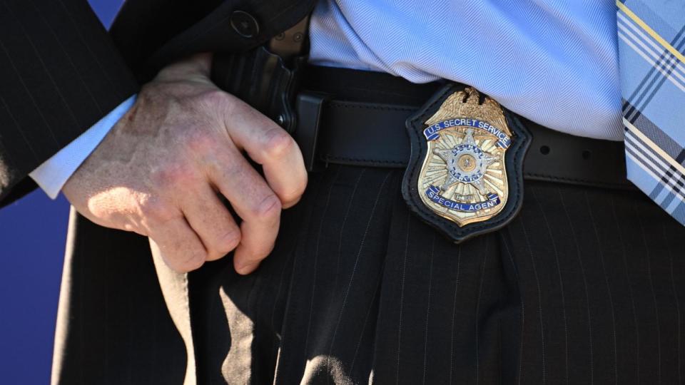 PHOTO: In this Oct. 13, 2023 file photo, a member of the Secret Service monitors activity as U.S. President Joe Biden speaks at Tioga Marine Terminal  in Philadelphia. (Mark Makela/Getty Images, FILE)