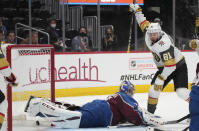 Vegas Golden Knights center Jonathan Marchessault, right, reacts after soring a goal past Colorado Avalanche goaltender Philipp Grubauer during the third period of Game 5 of an NHL hockey Stanley Cup second-round playoff series Tuesday, June 8, 2021, in Denver. (AP Photo/David Zalubowski)