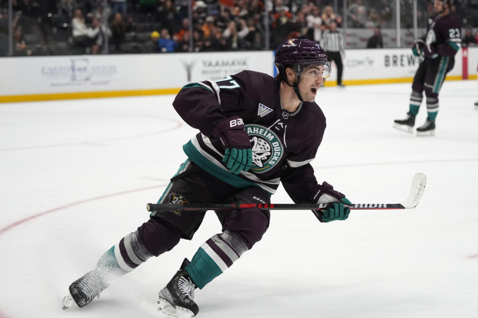 Anaheim Ducks' Frank Vatrano skates toward the team's bench after his hat-trick during the third period of an NHL hockey game against the Carolina Hurricanes, Sunday, Oct. 15, 2023, in Anaheim, Calif. The Ducks won 6-3. (AP Photo/Jae C. Hong)