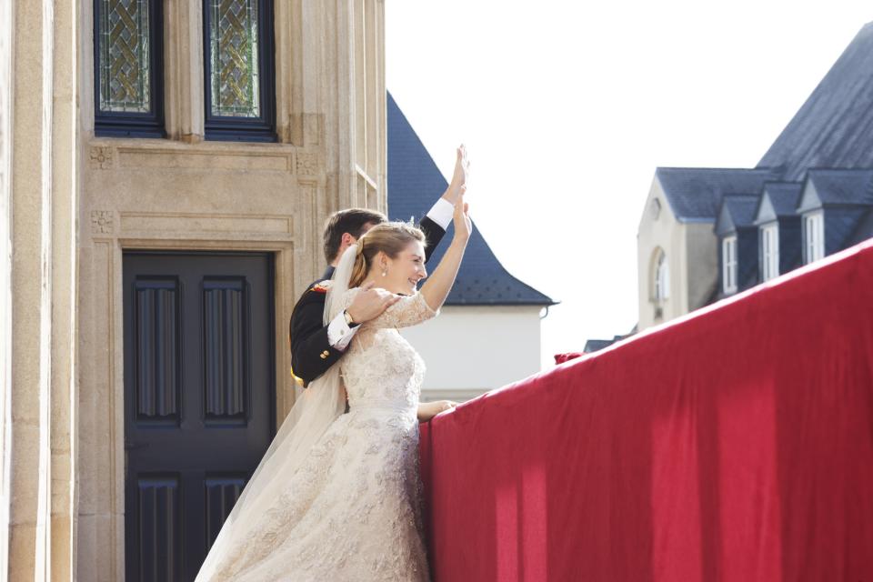 LUXEMBOURG - OCTOBER 20: (NO SALES, NO ARCHIVE) In this handout image provided by the Grand-Ducal Court of Luxembourg, Princess Stephanie of Luxembourg and Prince Guillaume of Luxembourg wave from the balcony of the Grand-Ducal Palace after their wedding ceremony at the Cathedral of our Lady of Luxembourg on October 20, 2012 in Luxembourg, Luxembourg. The 30-year-old hereditary Grand Duke of Luxembourg is the last hereditary Prince in Europe to get married, marrying his 28-year old Belgian Countess bride in a lavish 2-day ceremony. (Photo by Grand-Ducal Court of Luxembourg via Getty Images)