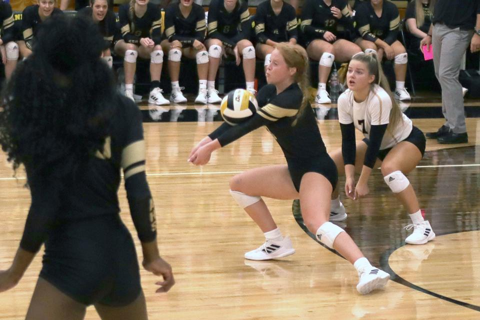 Amarillo HIgh's Sienna Cavalier, center, returns the ball at the match against Frenship, Tuesday, Aug. 16, 2022, at Amarillo High School.