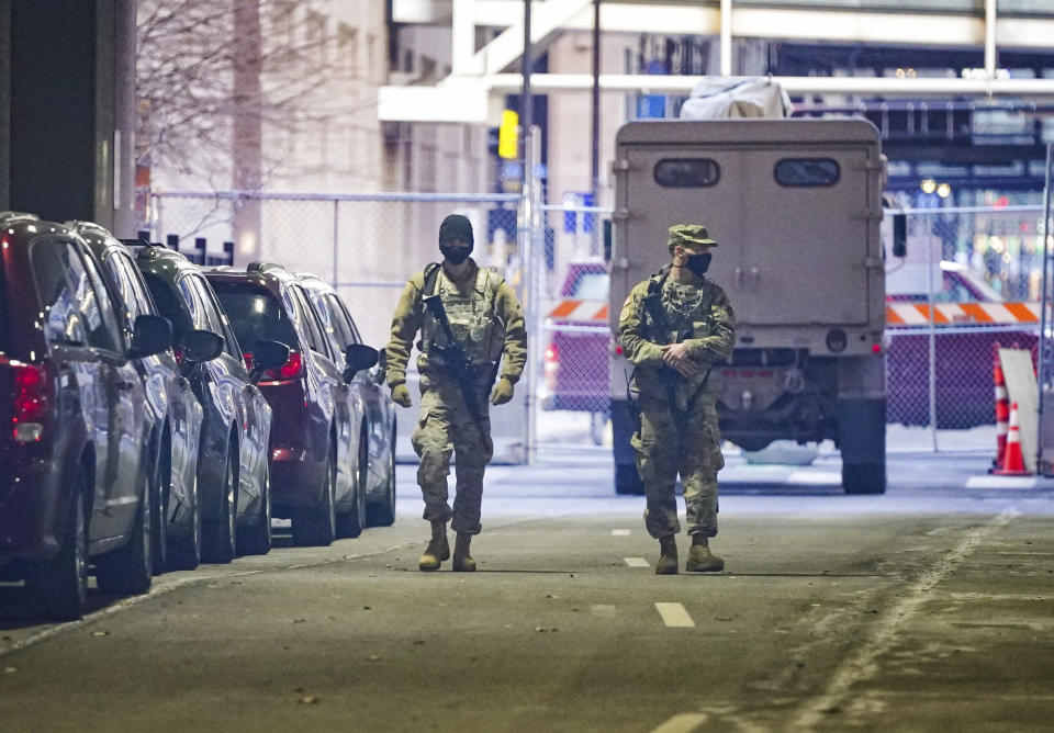 National Guard troops patrol under the Hennepin County Courthouse in Minneapolis, Minn., Monday, March 8, 2021, the site of the trial of former Minneapolis police officer Derek Chauvin in the death of George Floyd. (Glen Stubbe/Star Tribune via AP)