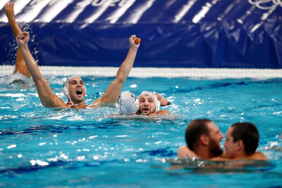 Players of Greece celebrate after their semi-final win.