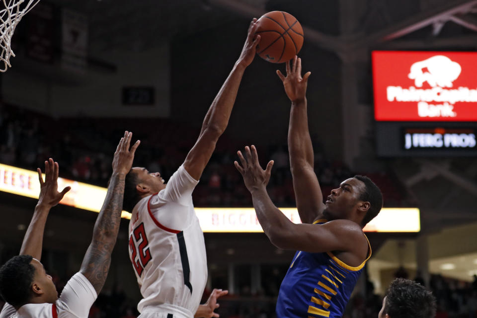 Texas Tech's TJ Holyfield (22) blocks a shot by Cal State Bakersfield's Ronne Readus (0) during the first half of an NCAA college basketball game Sunday, Dec. 29, 2019, in Lubbock, Texas. (AP Photo/Brad Tollefson)