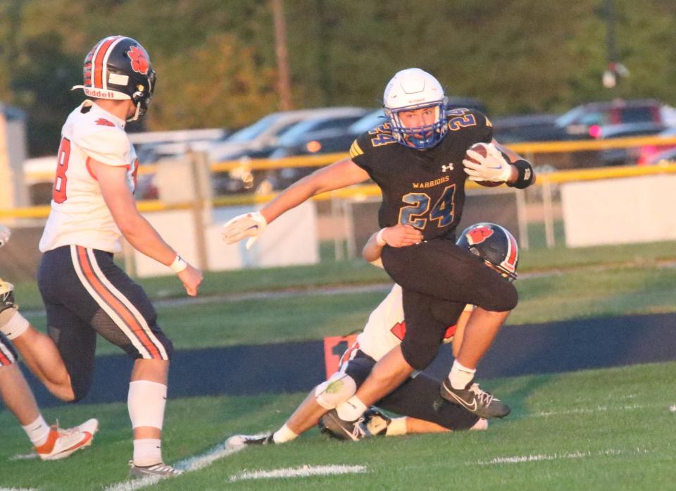 Ontario's Chase Studer rumbles for a big gain as he racked up 114 yards rushing during the Warriors' 59-35 win over Galion on Friday night.