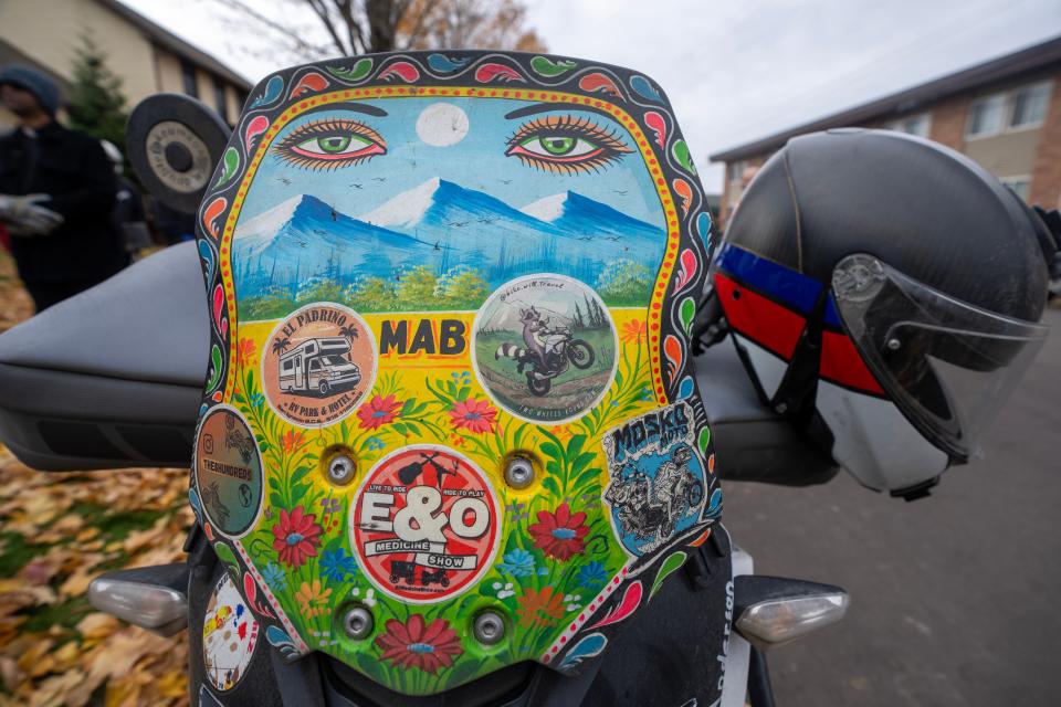 Bridget McCutchen’s motorcycle, named Mab, sports a windscreen that was painted while traveling through Pakistan. McCutchen set a world-record for being the youngest person to circumnavigate the world on her motorcycle Saturday, November 4, 2023 in Ashland, Wis. She started her journey in August 2022 and traveled through 45 countries.