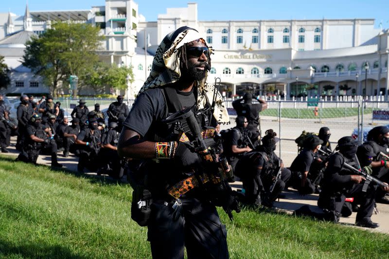 Members and supporters of an all-black militia group called NFAC hold an armed rally in Louisville