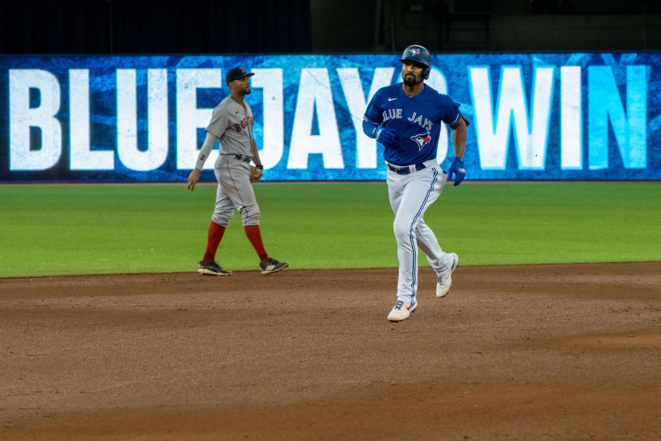 Aug 7, 2021; Toronto, Ontario, CAN; Toronto Blue Jays shortstop Marcus Semien (10) hits a walk off home run against the Boston Red Sox during the seventh inning at Rogers Centre. Mandatory Credit: Kevin Sousa-USA TODAY Sports