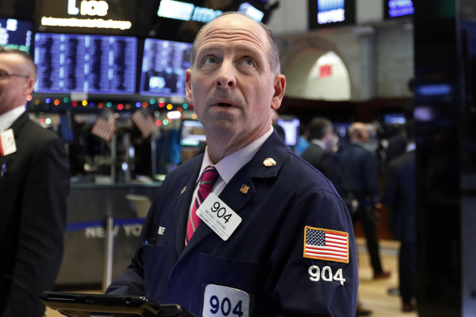 Trader Michael Urkonis works on the floor of the New York Stock Exchange, Thursday, Dec. 27, 2018. Wall Street's wild Christmas week goes on, with the Dow Jones Industrial Average slumping 300 points at the open Thursday, a day after notching its biggest-ever point gain. (AP Photo/Richard Drew)