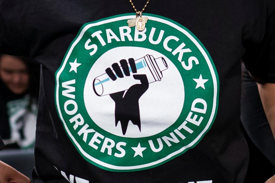 The Starbucks Workers United logo appears on the shirt of a person attending a hearing in Washington on March 29. Starbucks sued the union organizing its workers in Iowa on Wednesday, saying a pro-Palestine social media post from a union account early in the Israel-Hamas war angered hundreds of customers and damaged its reputation.