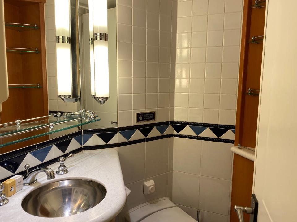 sink and toilet in a bathroom in a disney magic stateroom