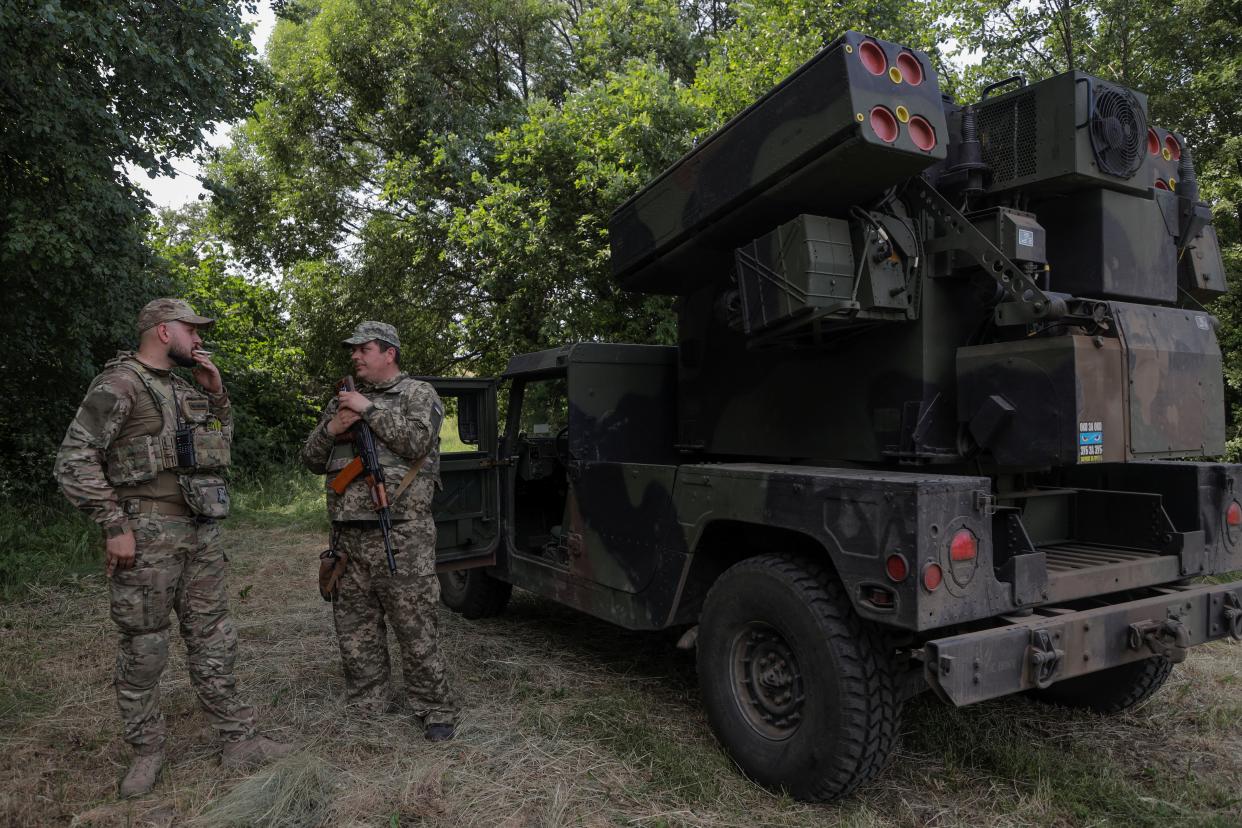 Ukrainian servicemen stand next to an AN/TWQ-1 Avenger mobile air defence missile system during their combat shift (REUTERS)