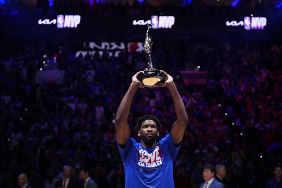 Philadelphia 76ers' Joel Embiid holds up the NBA Most Valuable Player trophy ahead of Game 3 in an NBA basketball Eastern Conference semifinals playoff series against the Boston Celtics, Friday, May 5, 2023, in Philadelphia. (AP Photo/Matt Slocum)