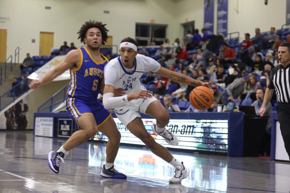 Lubbock Christian University forward Russell Harrison (24) drives past Angelo State guard Willie Guy (5) during the Chaparrals' 67-66 home victory Thursday night against the 14th-ranked Rams.