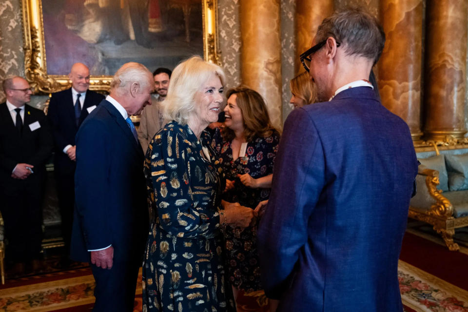 queen camilla smiling at kenneth yeo
