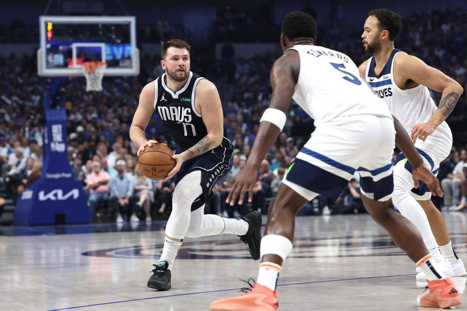 DALLAS, TEXAS - MAY 28:  Luka Doncic #77 of the Dallas Mavericks handles the ball against the Minnesota Timberwolves during the first quarter in Game Four of the Western Conference Finals at American Airlines Center on May 28, 2024 in Dallas, Texas. NOTE TO USER: User expressly acknowledges and agrees that, by downloading and or using this photograph, User is consenting to the terms and conditions of the Getty Images License Agreement. (Photo by Matthew Stockman/Getty Images)