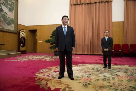 Leader of the Chinese Communist Party Xi Jinping (C) waits to greet former U.S. President Jimmy Carter in room 202 of the Zhongnanhai leadership compound in Beijing in this December 13, 2012 file photo. REUTERS/Ed Jones/Pool/Files