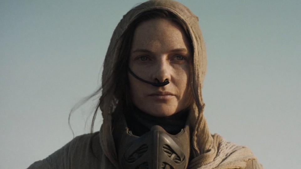 Rebecca Ferguson's Lady Jessica dressed like a Fremen in a hood and stillsuit in Dune