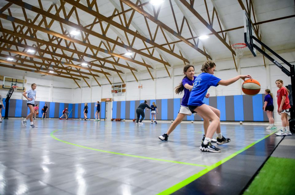 Young basketball players practice on the basketball court at Torq Fitness & Performance, 109 Harvey Court in East Peoria.