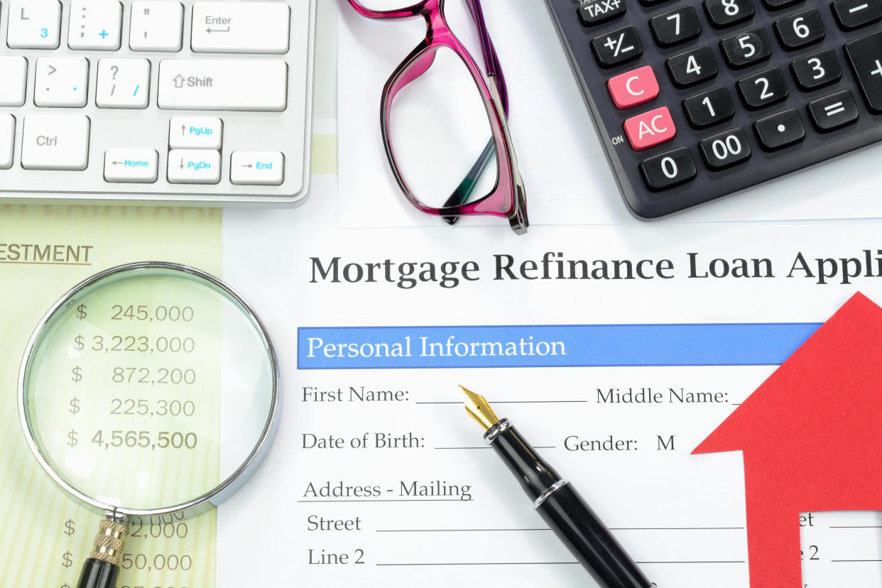 There is a lot to consider when refinancing your mortgage. / Credit: / Getty Images