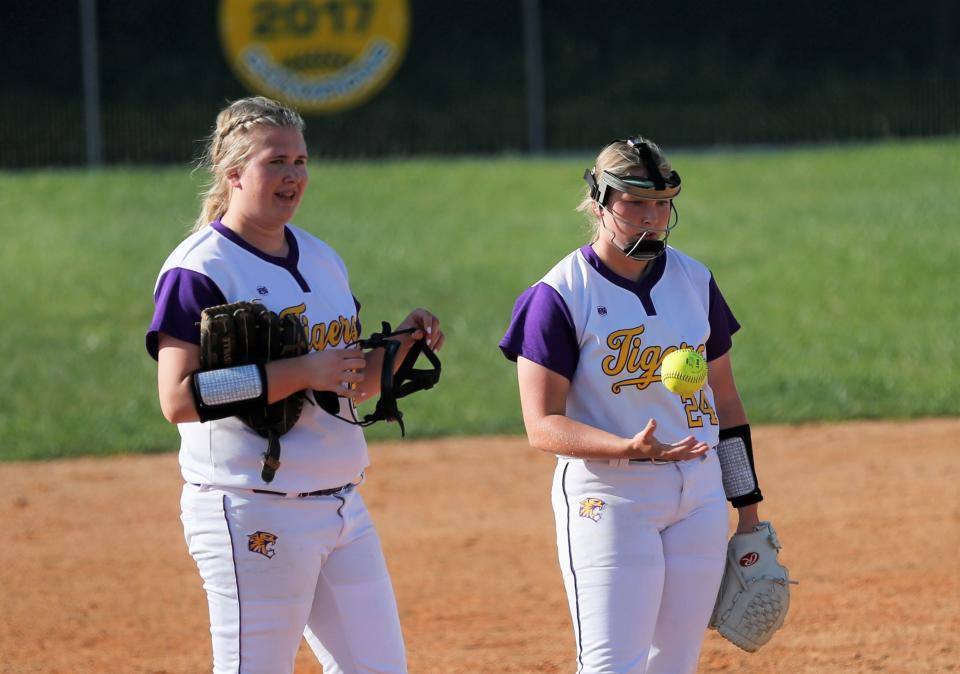 Hagerstown freshman Rylan Young (right) and senior Marisa Slagle (left) wait for their pitcher between innings of a game against Northeastern May 12, 2022.