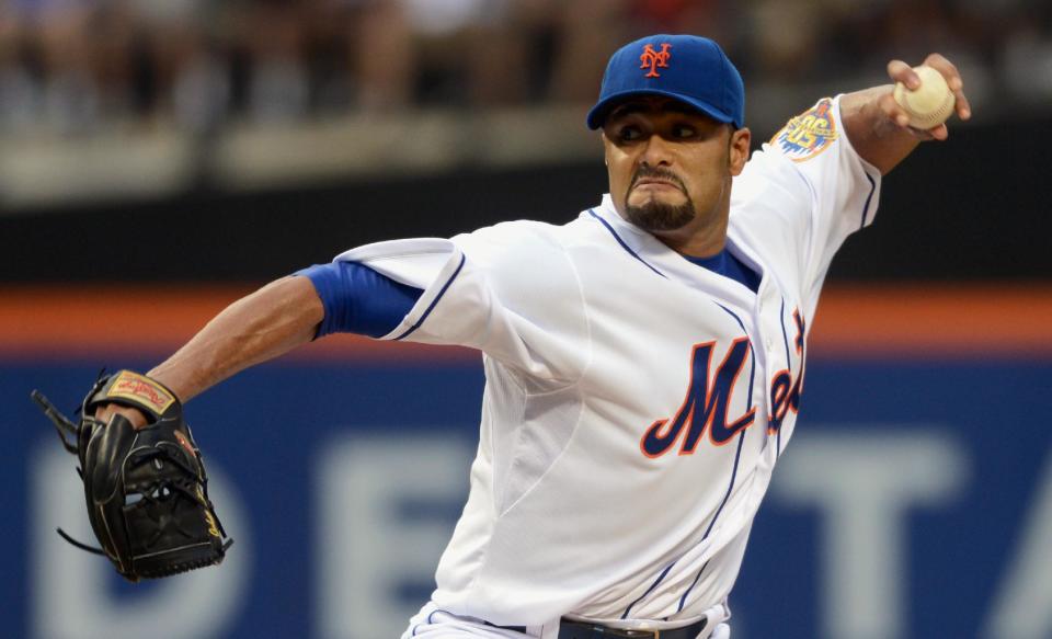 FILE - In this file photo taken Aug. 11, 2012, New York Mets' Johan Santana pitches in baseball game in New York. The two-time AL Cy Young Award winner has agreed to a minor league contract with the Baltimore Orioles, in a deal announced Tuesday, March 4, 2014, as he tries to come back from the second major operation on his left shoulder. (AP Photos/Henny Ray Abrams, file)