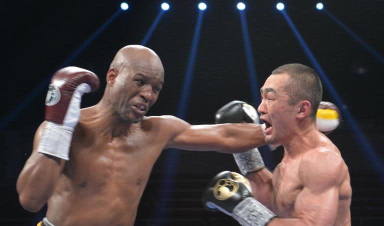 Bernard Hopkins (L) of the US defends against Beibut Shumenov (R) of the US during their WBA & IBA Light-heavyweight title fight at the DC Armory in Washington on April 19, 2014
