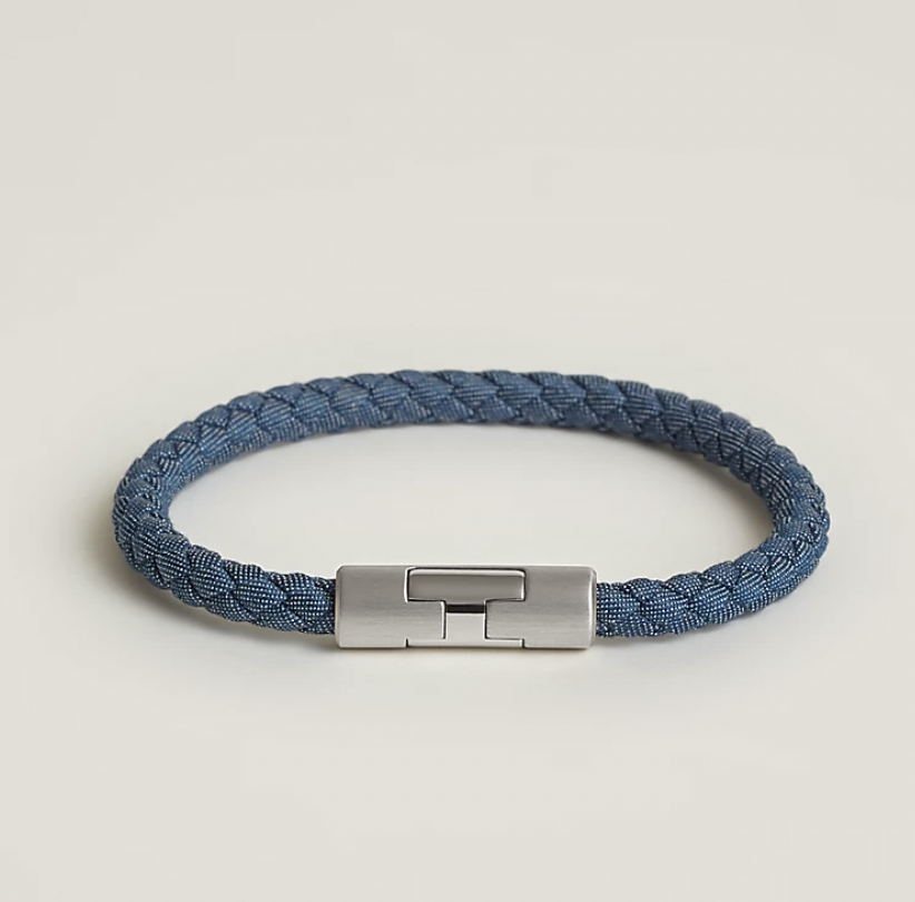 <p><a href="https://www.hermes.com/us/en/product/puzzle-h-jean-bracelet-H077306FPJBT6/" rel="nofollow noopener" target="_blank" data-ylk="slk:Shop Now;elm:context_link;itc:0;sec:content-canvas" class="link ">Shop Now</a></p><p>Puzzle H Jean Bracelet</p><p>Hermès</p><p>$390.00</p>