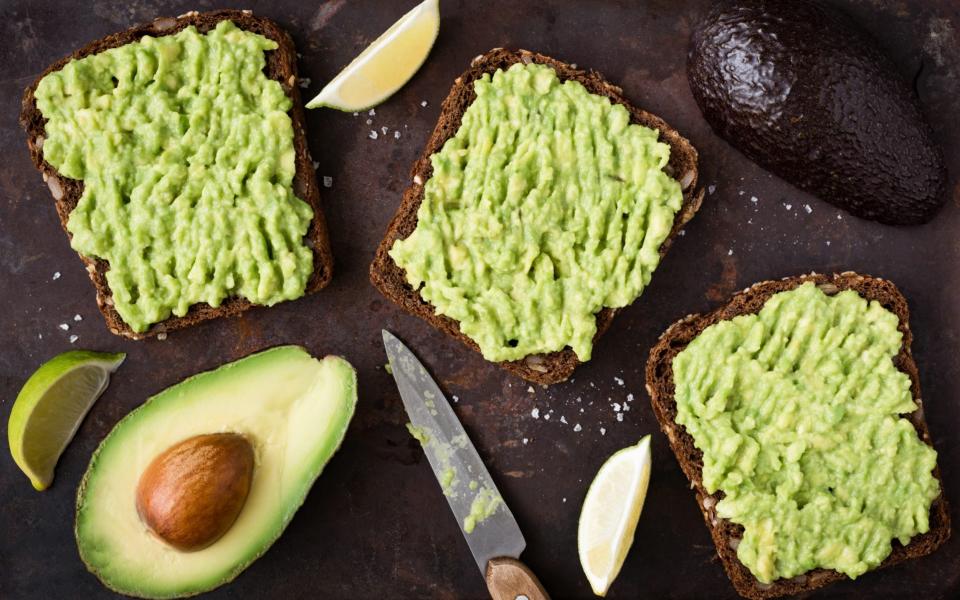Avocado are a healthy source of fat  - Getty 