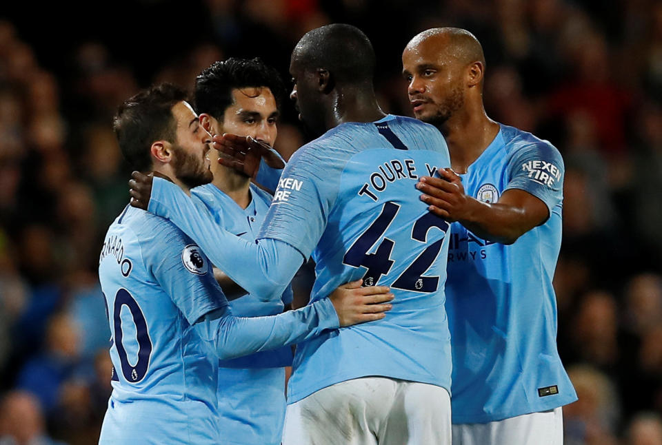 Soccer Football – Premier League – Manchester City v Brighton & Hove Albion – Etihad Stadium, Manchester, Britain – May 9, 2018 Manchester City’s Yaya Toure speaks with Vincent Kompany (R), Ilkay Gundogan (2nd L) and Bernardo Silva (L) as he is substituted off. Action Images via Reuters/Jason Cairnduff