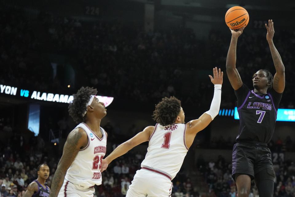 Grand Canyon Antelopes guard Tyon Grant-Foster (7) shoots the ball over Alabama Crimson Tide guard Mark Sears (1) in the first half at Spokane Veterans Memorial Arena.