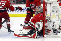 Carolina Hurricanes goaltender Antti Raanta (32) eyes the puck against the Florida Panthers during the first period of Game 2 of the NHL hockey Stanley Cup Eastern Conference finals in Raleigh, N.C., Saturday, May 20, 2023. (AP Photo/Karl B DeBlaker)