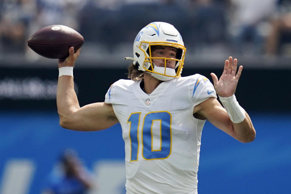 Los Angeles Chargers quarterback Justin Herbert (10) throws during the first half of an NFL football game against the Dallas Cowboys Sunday, Sept. 19, 2021, in Inglewood, Calif. (AP Photo/Ashley Landis )