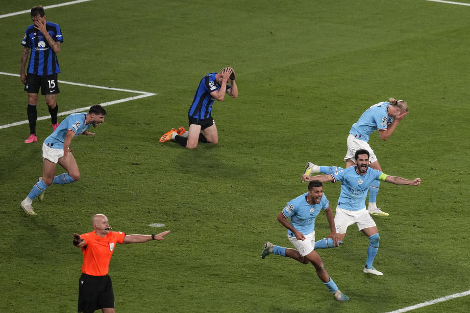 Manchster City players celebrate their 1-0 win at the end of the Champions League final soccer match between Manchester City and Inter Milan at the Ataturk Olympic Stadium in Istanbul, Turkey, Saturday, June 10, 2023. (AP Photo/Thanassis Stavrakis)