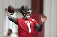 Atlanta Falcons quarterback Marcus Mariota throws a pass during NFL football practice Thursday, May 26, 2022, in Flowery Branch, Ga. (AP Photo/John Bazemore)