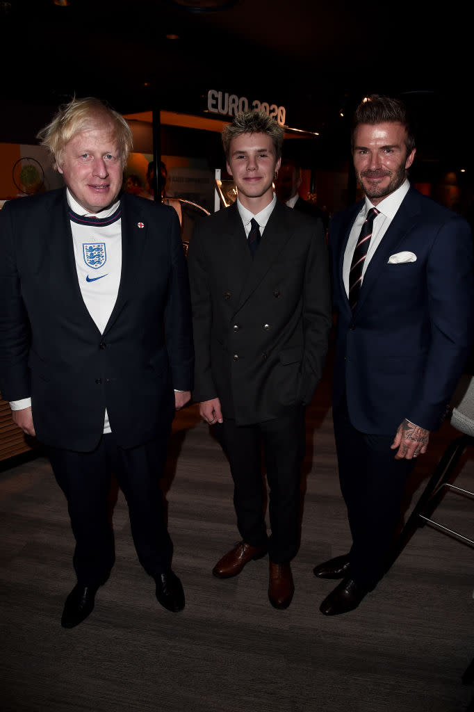 David and Cruz Beckham have been pictured swimming with sharks, pictured with Boris Johnson in July 2021. (Getty Images)