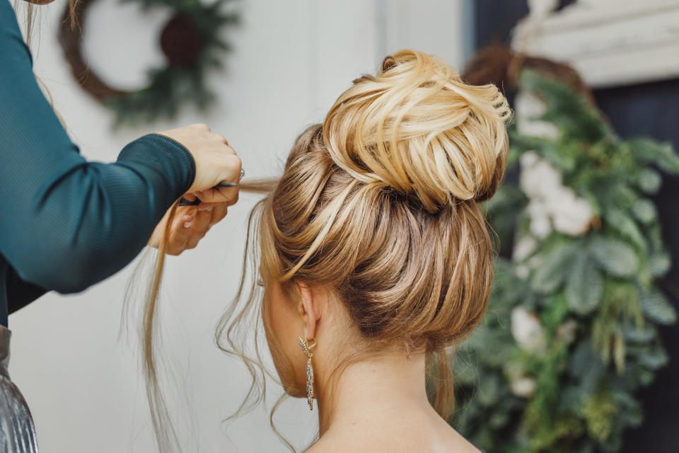 A bride gets her hair done