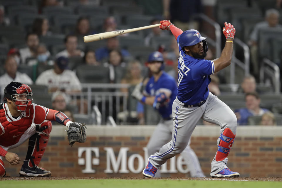 Toronto Blue Jays' Teoscar Hernandez swings for an RBI single in the eighth inning of a baseball game against the Atlanta Braves Tuesday, May 11, 2021, in Atlanta. (AP Photo/Ben Margot)