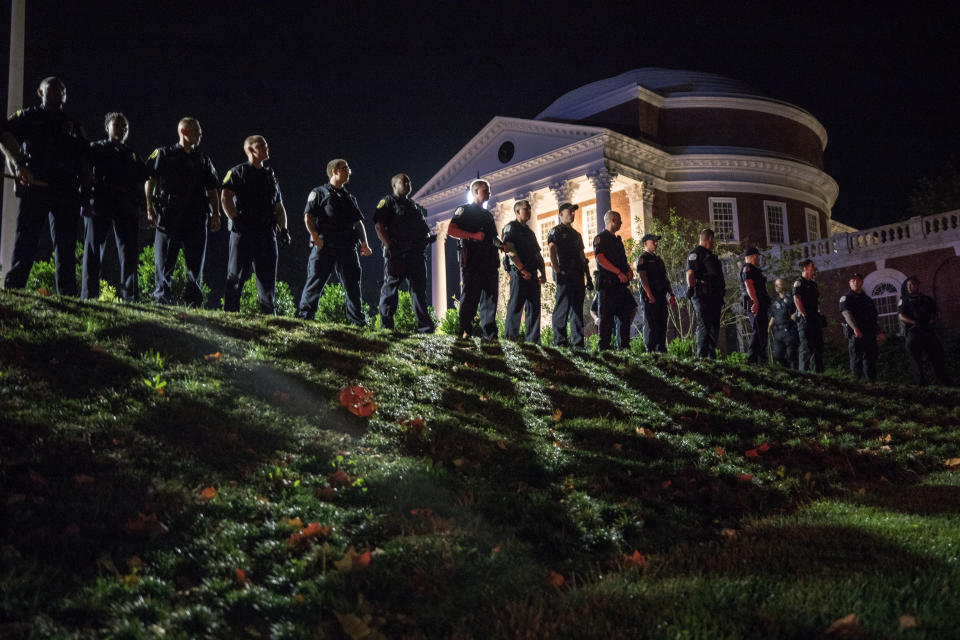 <p>Campus police at the University of Virginia following a march of hundreds of white nationalists and white supremacists carrying torches through the University of Virginia campus in Charlottesville, Va., on Aug. 11, 2017. (Photo: Evelyn Hockstein/For The Washington Post via Getty Images) </p>