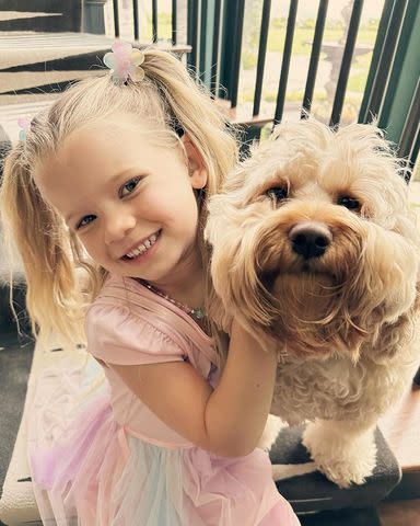 <p>Jessica Simpson/ Instagram </p> Simpson's daughter Birdie with pet dog Dixie