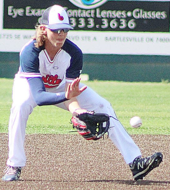 Bartlesville Doenges Ford Indians shortstop Brenden Asher scoops up a bouncer during Oklahoma College League play Wednesday afternoon at Bill Doenges Memorial Stadium.