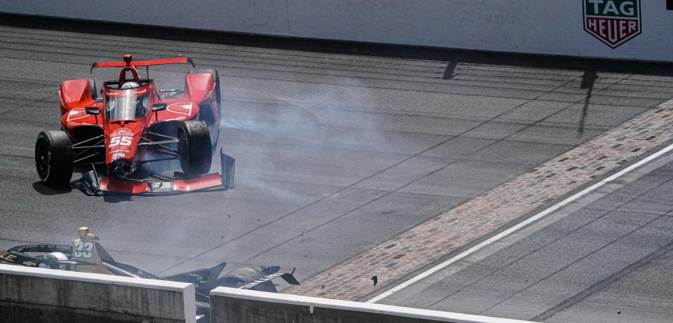 A. J. Foyt Enterprises driver Benjamin Pedersen (55) and Ed Carpenter Racing driver Ed Carpenter (33) crash in the final moments of the race on Sunday, May 28, 2023, after winning the 107th running of the Indianapolis 500 at Indianapolis Motor Speedway. 