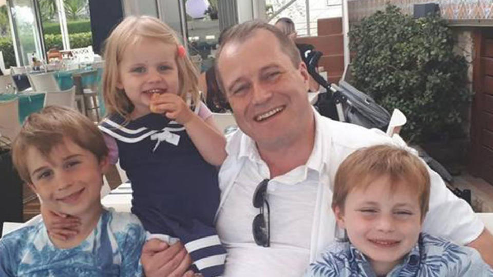 Andrew McGinley pictured with his three children – Conor, 9, Carla, 3 and Darragh, 7.