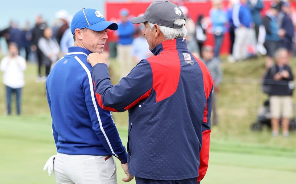 Rory McIlroy (left) chats with Team USA vice-captain Fred Couples - GETTY IMAGES